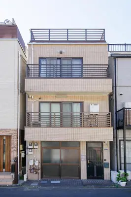 a tall building with a balcony on top of it at Higashi Shinagawa Apartment by Tranova in Tokyo