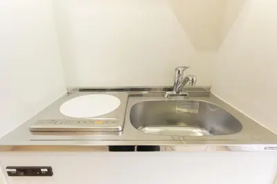a kitchen counter with a sink and a sink at Nano North Shinjuku Apartment by Tranova in Tokyo