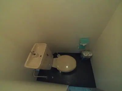a bathroom with a toilet in a small room at Miki Hall Akabane in Tokyo