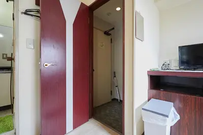 a door leading into a room with a hallway at Miki Hall Akabane in Tokyo