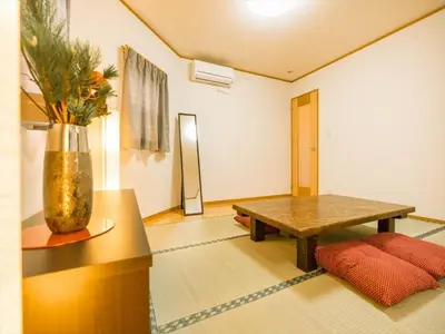 a living room with a wooden table and a vase at Katsushika-ku - House / Vacation STAY 5375 in Tokyo