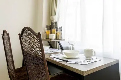 a table with plates and bowls on top of it at Hotel Shibuya Shoto in Tokyo