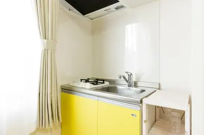 a small kitchen with a sink and a window at Hotel Shibuya Shoto in Tokyo