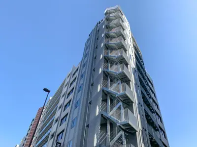 a tall building with balconies on the side of it at HOTEL LiVEMAX Tokyo Kanda EAST in Tokyo