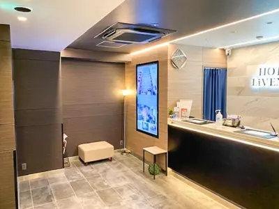a lobby with a large screen in a building at HOTEL LiVEMAX Tokyo Kanda EAST in Tokyo