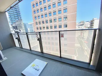 a balcony with a view of a large building at Akasaka Residence in Tokyo
