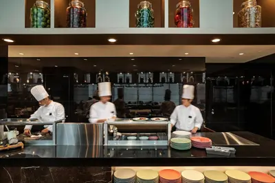 a group of chefs in a kitchen preparing food at Villa Fontaine Grand Tokyo Ariake in Tokyo