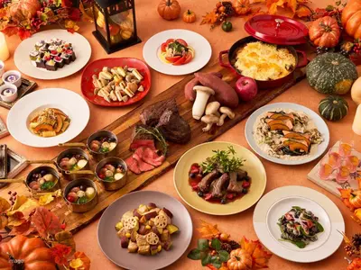 a table filled with plates of food and pumpkins at Villa Fontaine Grand Tokyo Ariake in Tokyo