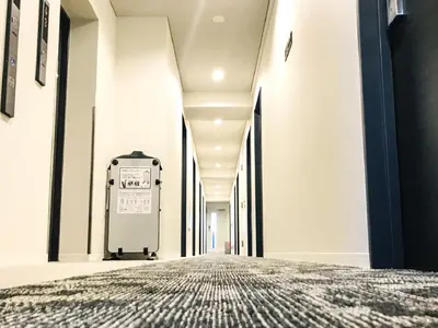 an empty corridor of a hospital with a bed at HOTEL LiVEMAX Shinjuku Kabukicho-Meijidori in Tokyo