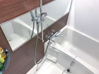 a shower in a bathroom with a sink at HOTEL LiVEMAX Shinjuku Kabukicho-Meijidori in Tokyo