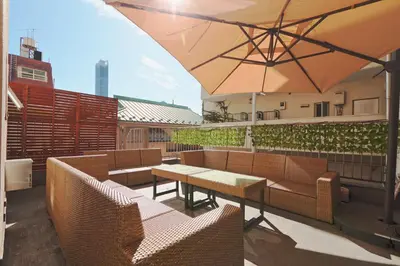 a patio with a table and chairs and an umbrella at V.Close to Shinjuku Kabukicho/Korean Town/FrWIFI D in Tokyo