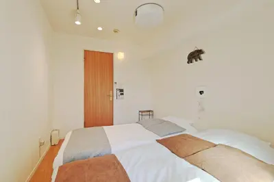 a bedroom with a large white bed with two pillows at V.Close to Shinjuku Kabukicho/Korean Town/FrWIFI D in Tokyo