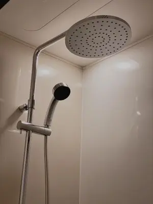 a shower head in a bathroom with a ceiling at THE TOURIST HOTEL & Cafe AKIHABARA in Tokyo