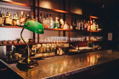 a green lamp sitting on top of a bar at Hotel K5 in Tokyo