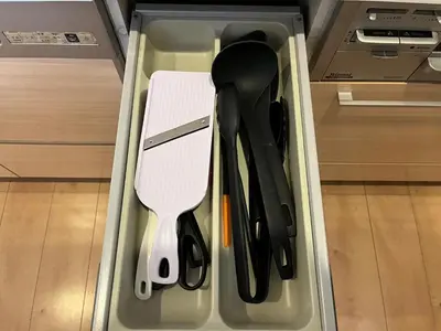 a drawer with knives and utensils in it at Ishihara House in Tokyo