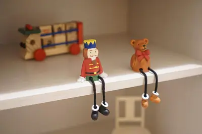 two small toy figurines on a shelf with a teddy bear at 4 bedrooms cozy house, 5 min JR train to Shinjuku, GRADIA Koenji in Tokyo