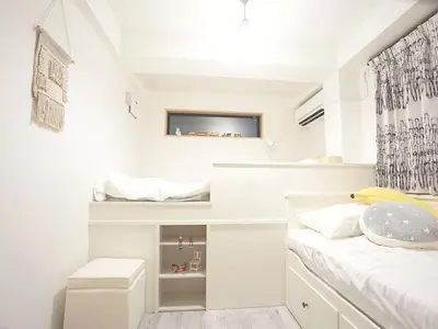 a white bedroom with a bed and a desk at 4 bedrooms cozy house, 5 min JR train to Shinjuku, GRADIA Koenji in Tokyo