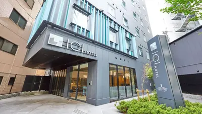 a building with a hilton sign in front of it at ICI HOTEL Tokyo Hatchobori in Tokyo