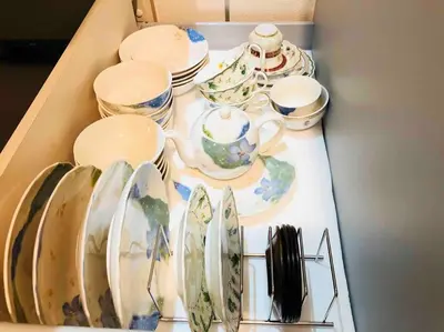 a table with plates and cups and dishes on it at Ikebukuro Station 7 minutes by walk 110 sqm villa in Tokyo