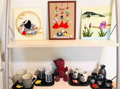 a shelf with a bunch of cups and pictures at Ikebukuro Station 7 minutes by walk 110 sqm villa in Tokyo