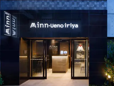 a store front of a building with a sign on it at Minn Ueno Iriya in Tokyo
