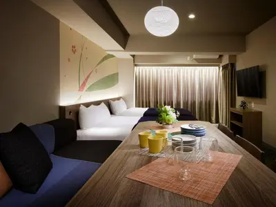 a living room with a white couch and a table at Minn Ueno Iriya in Tokyo