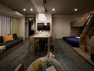 a living room with a couch and a dining room at Minn Ueno Iriya in Tokyo