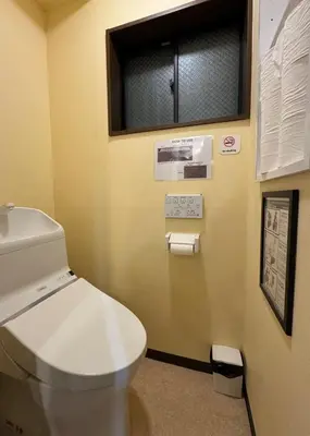 a bathroom with a white toilet and a window at LEMON TOKYO in Tokyo