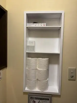 a refrigerator filled with lots of white towels at LEMON TOKYO in Tokyo
