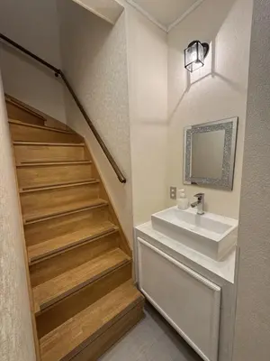 a bathroom with a sink and a staircase at LEMON TOKYO in Tokyo