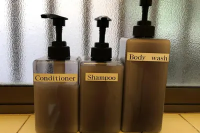 two bottles ofodorizers sitting next to each other at Cozy house \u845b\u98fe in Tokyo