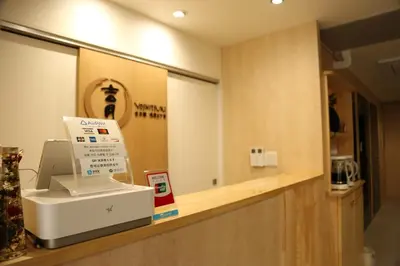a cashier counter with a cash register in a store at Yoshitsuki kaku - Yoshitsuki Apart Hotel in Tokyo