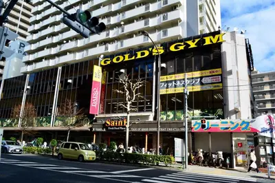 a building with a sign on the side of a street at Otsuka No3 Mansion#JR Yamanote Line Otsuka in Tokyo