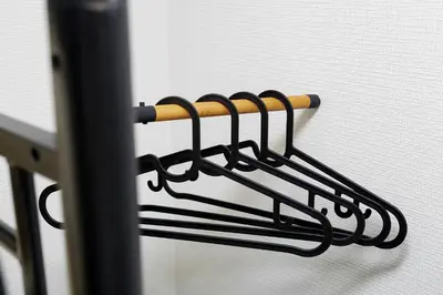 a black towel rack on a white wall at 043AKIHABARA in Tokyo