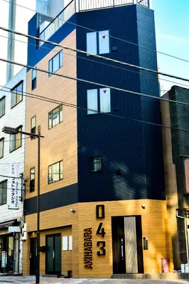 a building with a clock on the side of it at 043AKIHABARA in Tokyo