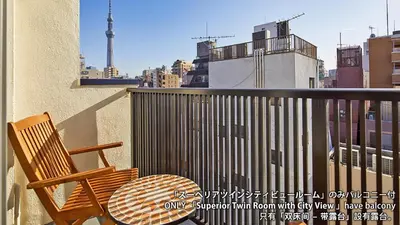 a patio with a table and a chair on a balcony at Stay SAKURA Tokyo Asakusa Yokozuna Hotel in Tokyo