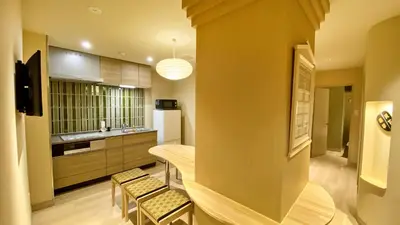 a kitchen with a table and chairs in a room at Stay SAKURA Tokyo Asakusa Yokozuna Hotel in Tokyo