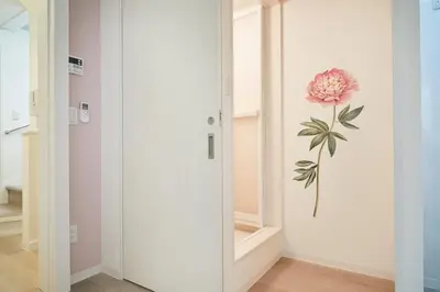a room with a door with a flower on the wall at Beautiful Villa in Shinjuku Shin-OKubo 6minutes walk B in Tokyo