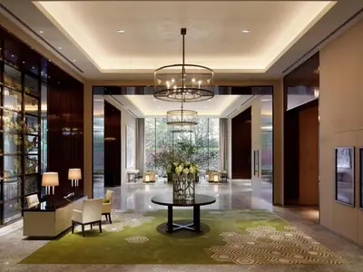 a lobby of a hotel with a table and chairs at Palace Hotel Tokyo in Tokyo