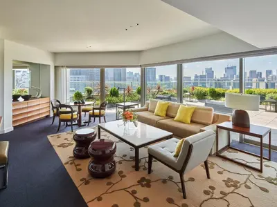 a living room with a couch and a table at Palace Hotel Tokyo in Tokyo