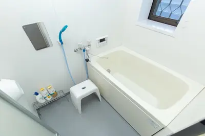 a white bathroom with a sink and a toilet at STATION SIDE113 in Tokyo