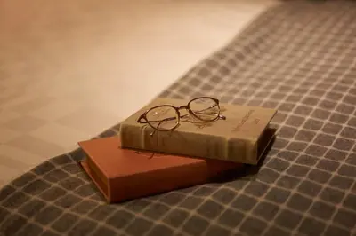 a pair of glasses sitting on top of a book at Hotel Resol Ueno in Tokyo