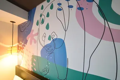 a mural of a lion on a wall in a room at Hotel Resol Ueno in Tokyo