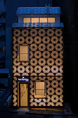 a building with a geometric design on the side of it at Shinjuku Miyabi Residence in Tokyo
