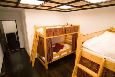 a room with two bunk beds and a bed at Shinjuku Miyabi Residence in Tokyo