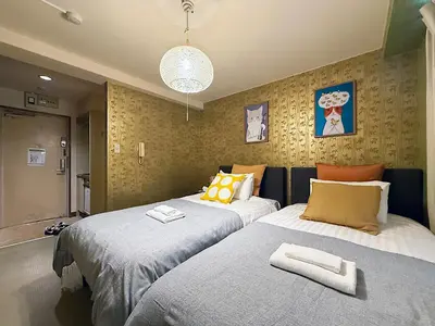 two beds sitting next to each other in a room at Asakusa Japanese Style Stay with Futon & Beds in Tokyo
