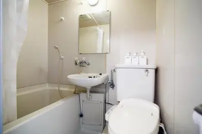 a bathroom with a toilet and a sink at Asakusa Japanese Style Stay with Futon & Beds in Tokyo