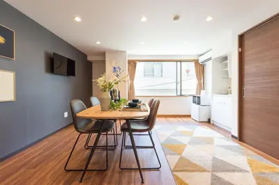 a kitchen and dining room with a table and chairs at TORA HOTEL Tokyo-Rikugienn \u5bc5\u30db\u30c6\u30eb \u516d\u7fa9\u5712 C in Tokyo