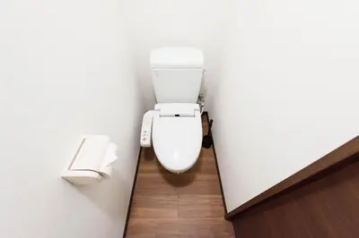 a bathroom with a white toilet in a stall at TORA HOTEL Tokyo-Rikugienn \u5bc5\u30db\u30c6\u30eb \u516d\u7fa9\u5712 C in Tokyo
