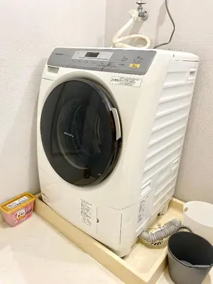 a white washing machine sitting on a counter at Alo BnB 6 - Near IKEBUKURO, SHINJUKU, UENO, AKIHABARA - Self check-in in Tokyo